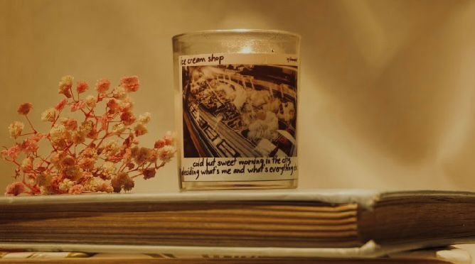 White candle with black label